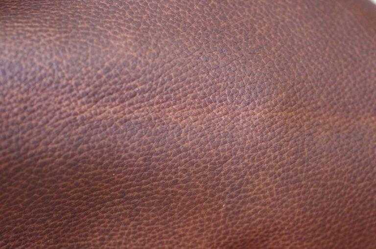 Wax non-sanded leather has artificially even grain pattern.