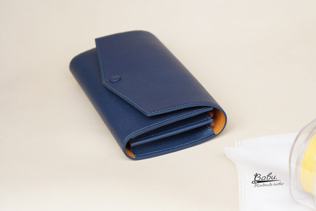 goat leather long wallet in navy blue