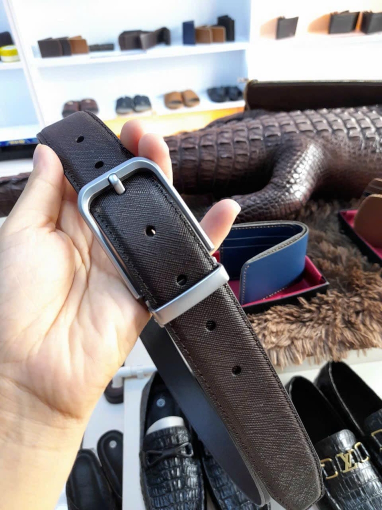 Chocolate brown leather belt for men on hand